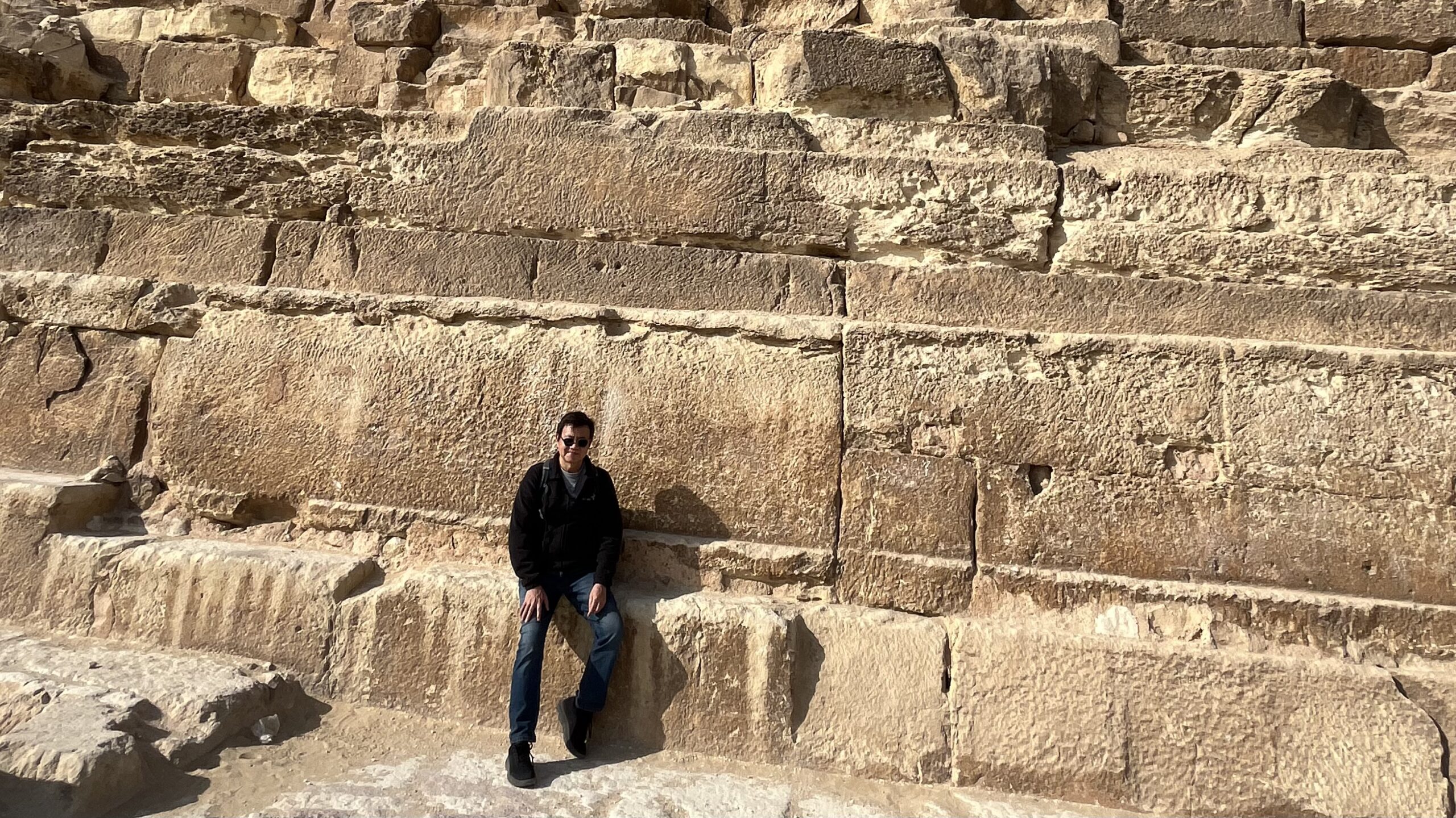 12-Day Egypt Itinerary: Self-guided traveler standing before the Great Pyramids of Giza, Egypt.