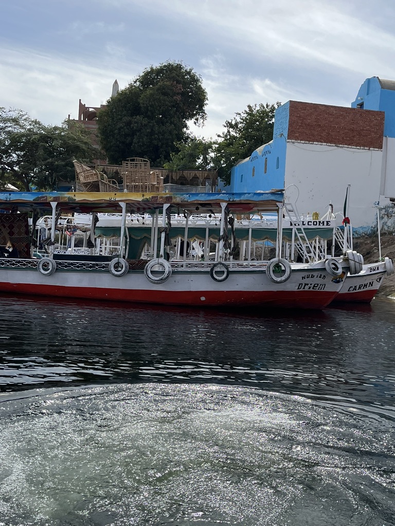 A traditional wooden motorboat, commonly used for transport between Aswan and the Nubian villages.