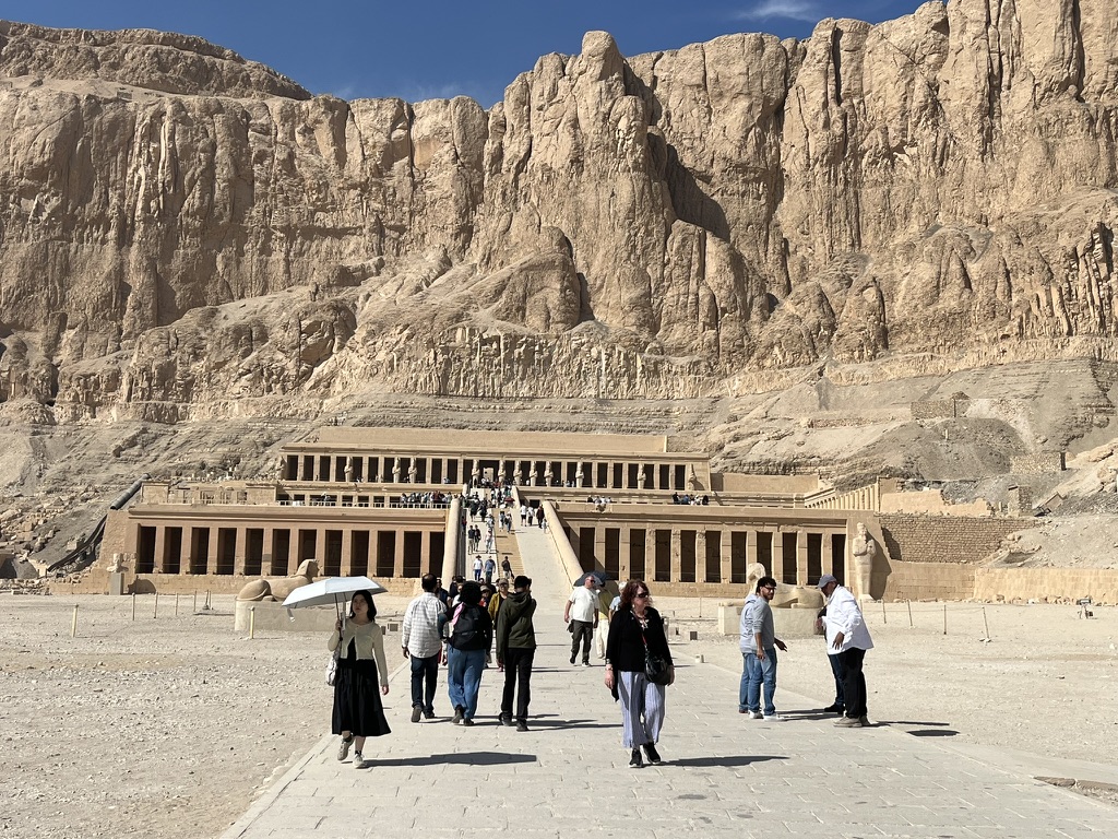 The three-tiered mortuary temple of Queen Hatshepsut, built directly into the sheer limestone cliffs of Deir el-Bahari.