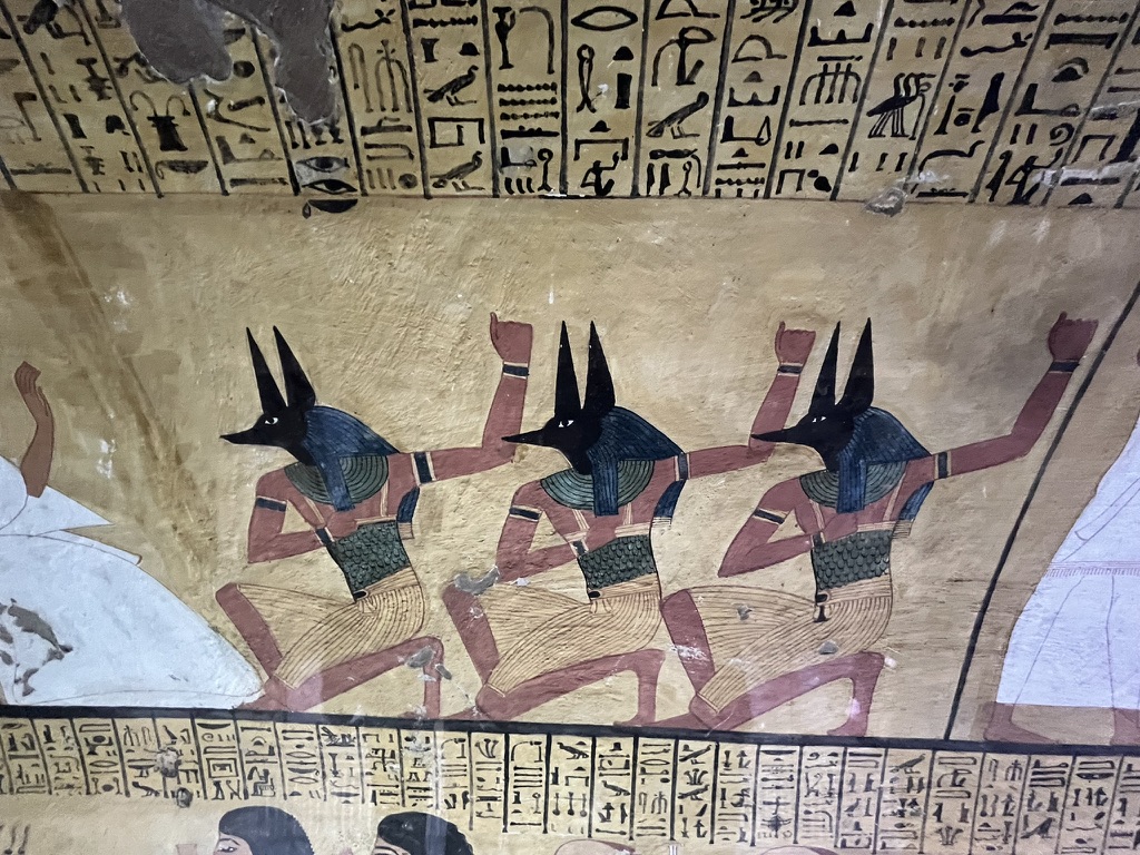 Deir el-Medina - Three jackal-headed ancestral spirits, known as the Souls of Pe, shown in a ritual pose of jubilation to protect the deceased in the afterlife.