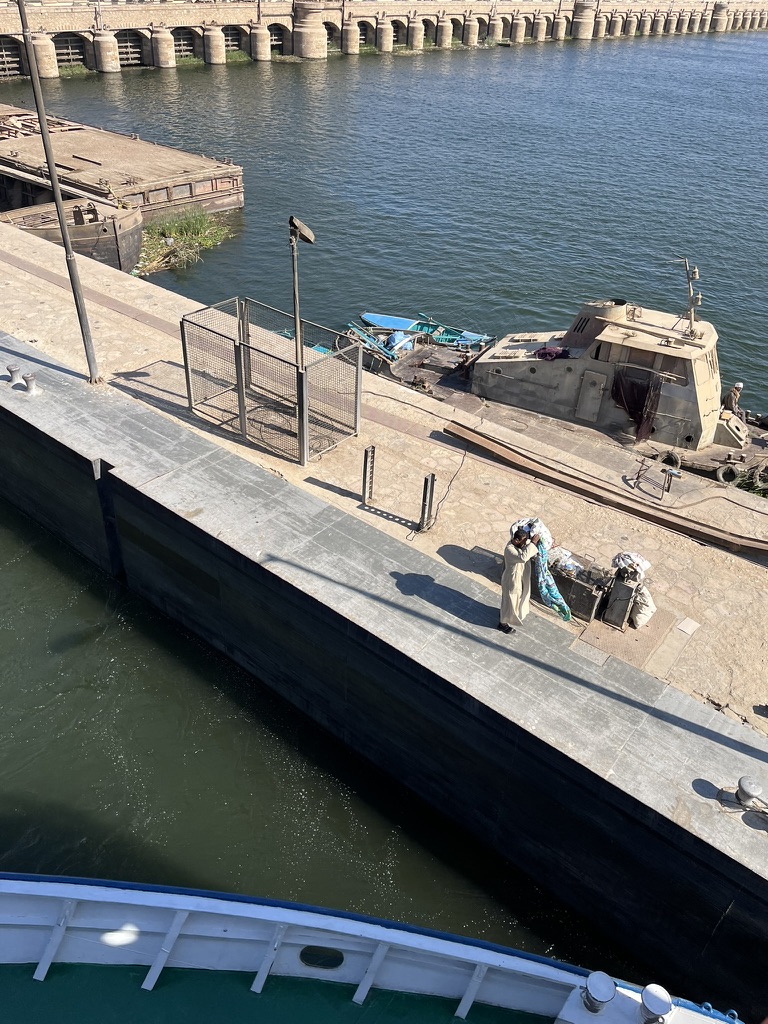 Local vendors tossing tablecloths and "galabeyas" up to passengers on the sun decks of cruise ships.