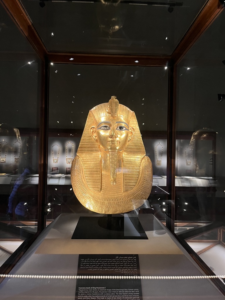 This stunning funerary mask of King Psusennes I, crafted from beaten gold with lapis lazuli and glass paste inlays, represents one of the few intact royal burials ever discovered in Egypt.