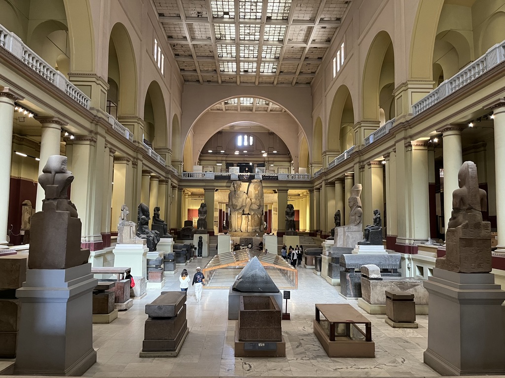 The grand atrium of the Egyptian Museum in Tahrir Square houses the towering figures of Amenhotep III and Tiye that anchor the main hall.