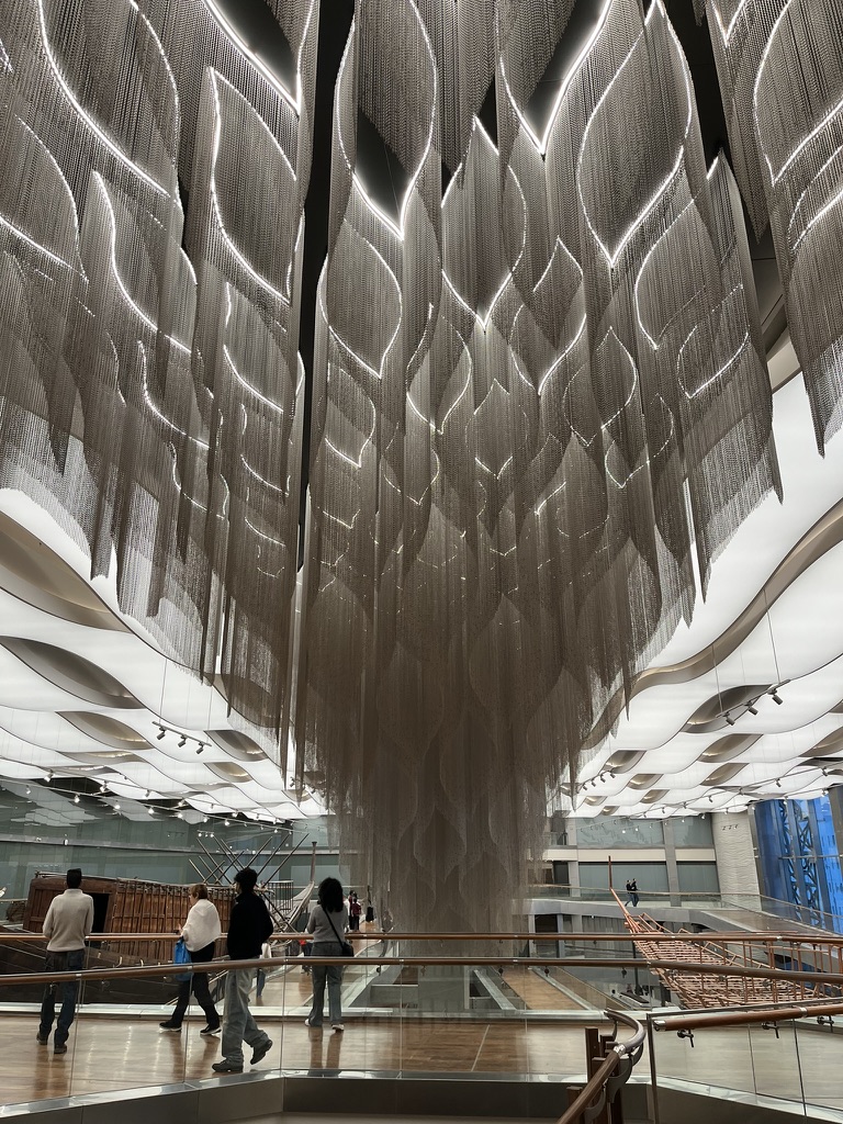 A large-scale architectural art installation overlooking the Khufu Solar Boat gallery.